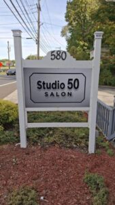 Studio 50 Salon sign outside salon entrance in Middletown NY on e Main St
